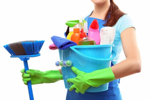 Local cleaners preparing a kitchen for move-out in W9