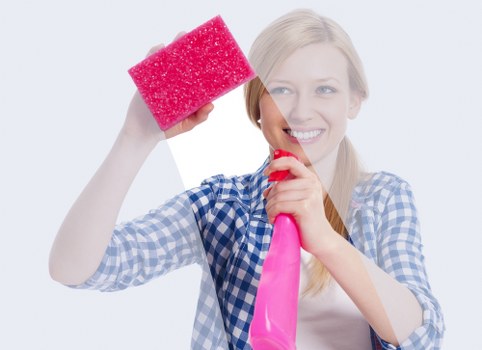 Local cleaner refreshing a bathroom during an Airbnb changeover in W9